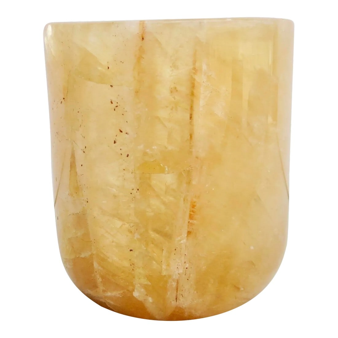 Rock Crystal Votive Cup: Rock Crystal calcite cup. Amber-colored bowl with thick walls, and faceted crystals that move in diagonals and horizontal directions in this carved cup. The size is 3.15" tall and 3" in diameter.