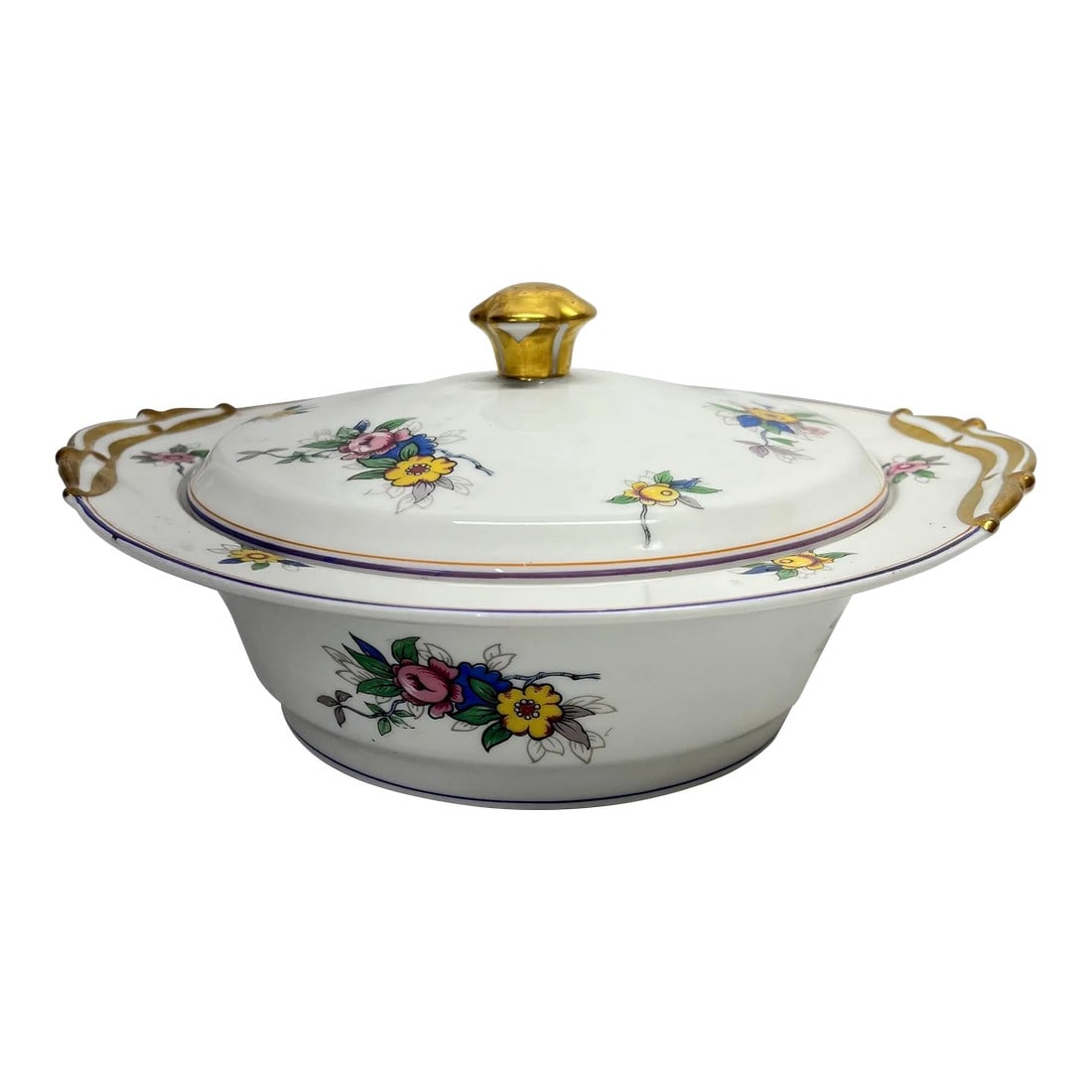 Limoges France Covered Serving Bowl: Limoges France covered serving bowl decorated with flowers in yellow, pink, blue and green. Adorned with gilt handles. Measures 10" w x 9.5" d x 5" h, without lid 2.75" h. Very minor wear. See mark