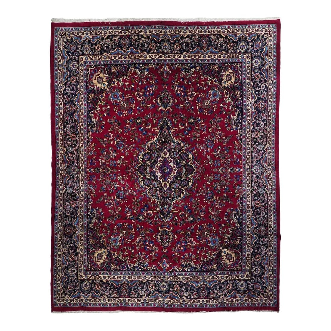 Vintage Persian Mashad Signed Rug 9'5'' X 12'2'': The tall, lozengoidal navy medallion has a compound acanthus edge which matches those of the pendants. Crisp cochinral red field with more-or-less detached floral sprays. Near black corner with