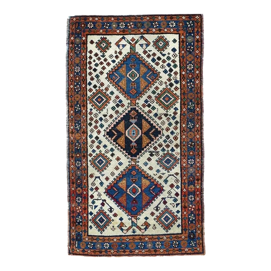 Vintage Persian Rug 2'6'' x 4'6'': The ecru field centres a pole medallion of three tab-fringed diamonds in medium blue and black, with red stylized leaf details. Smaller end suite nested diamonds and tertiary rosettes scattered