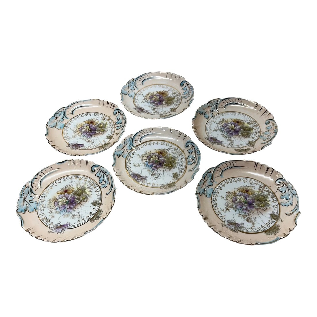 French Style Porcelain Floral Dessert Plates - Set of 6: These dessert / bread plates have an Old Pairs look. Made of very delicate porcelain in a pastel peach with blue highlights and a floral center in lavender, pale yellow and pale green all outlined in