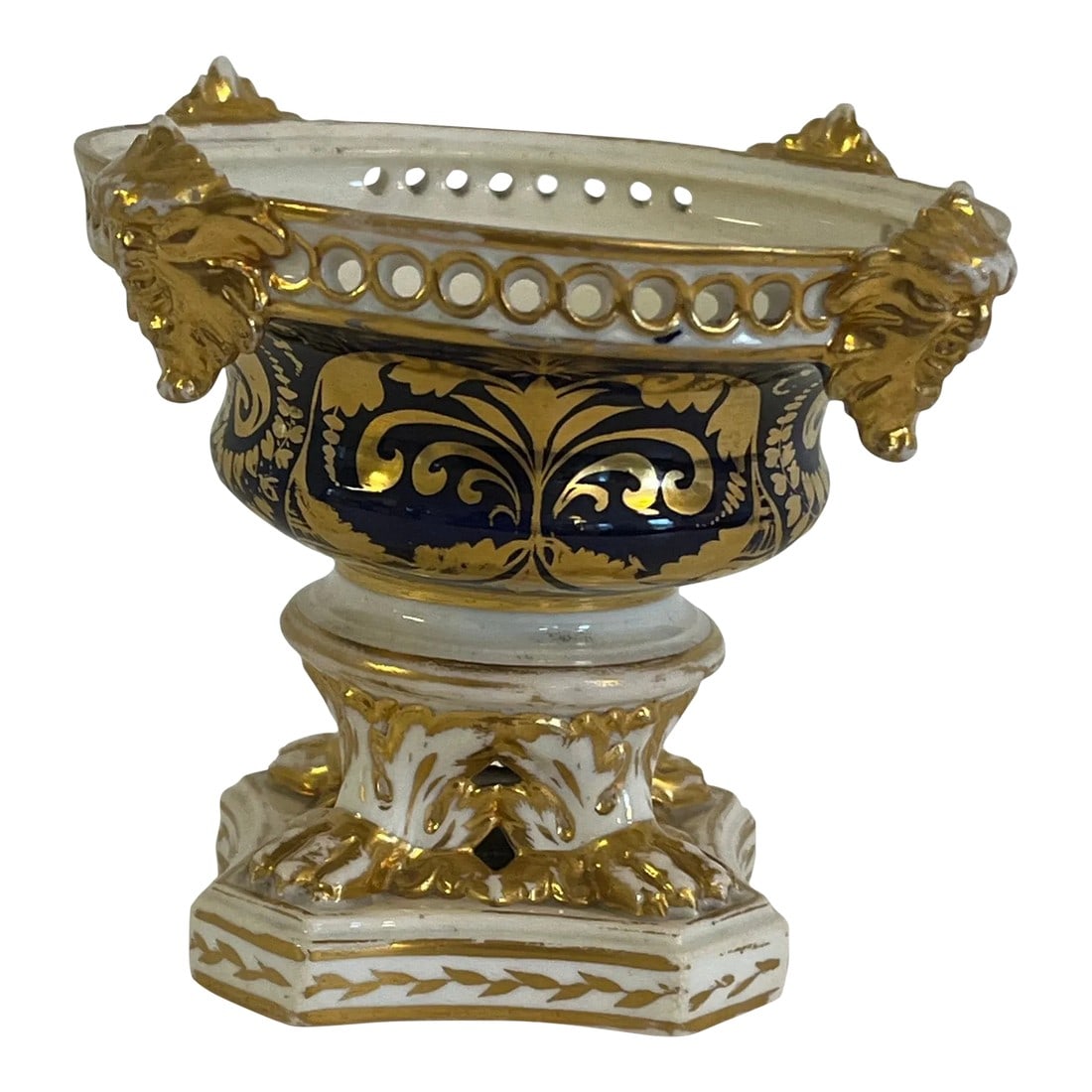 Mid 19th Century Royal Crown Derby Vase: Royal Crown Derby vase with cobalt blue and gold decoration. Four gilded gargoyles at the rim. Minor losses to the rim. May have had at one time a cover. Slightly uneven overall from the original