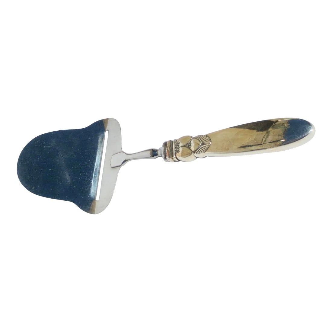 Georg Jensen Sterling Cheese Plane Cactus Pattern: Georg Jensen Sterling Cheese Plane Sterling handle and stainless steel blade. Cactus pattern circa 1930s'. Hallmarked to the back of the handle with Jensen and sterling. The size is 8" long and 3"