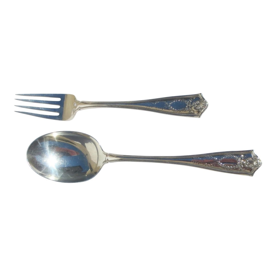 Tiffany & Co. Serving Set Circa 1909- a Set of 2: Tiffany & Co pattern from 1909. Serving set. graduated interlock garlands on the handle in a fine Beaux Arts style. Designed as a set and measures 9.5" the spoon and 8.75" the fork. INV SFB # 27A
