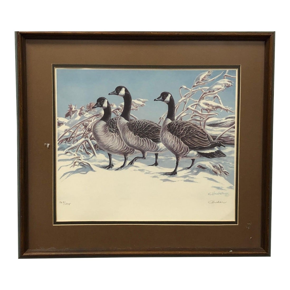 Vintage Lithograph of Three Geese Walking in the Snow, Brown Framed Signed: Vintage Lithograph of Three Geese Walking in the Snow, Brown Framed Charming vintage lithograph depicting three geese walking through a snowy landscape. The scene has a quiet, pastoral feel with soft