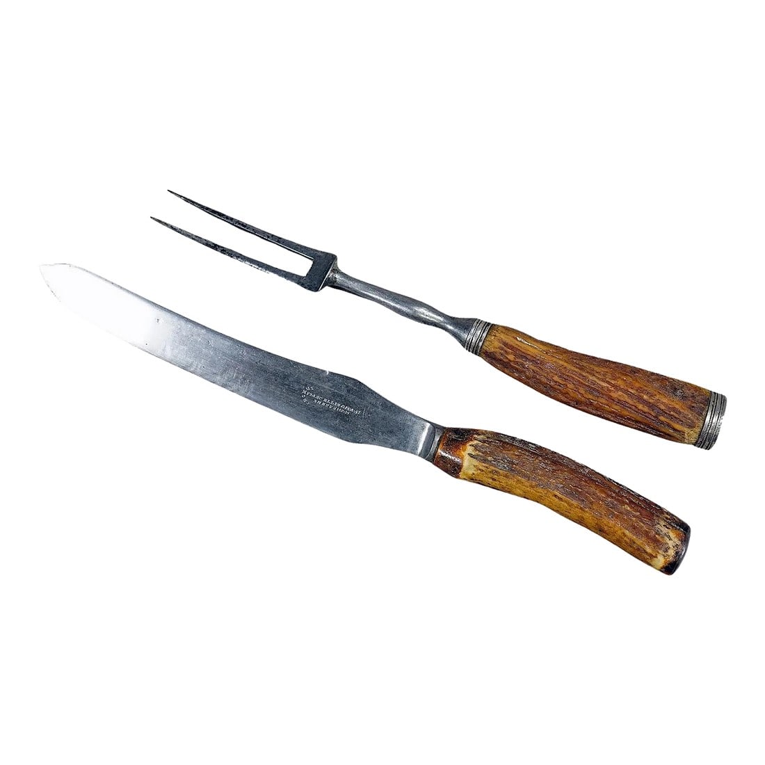 Antique Deer Horn Carving Set, Sheffield ca. 1900s - Set of 2: Antique Deer Horn Carving Set, Sheffield ca. 1900s A rustic carving set consisting of fork and knife. The handles are made of genuine deer horn and feature a silver knob on their ends. Blade and fork