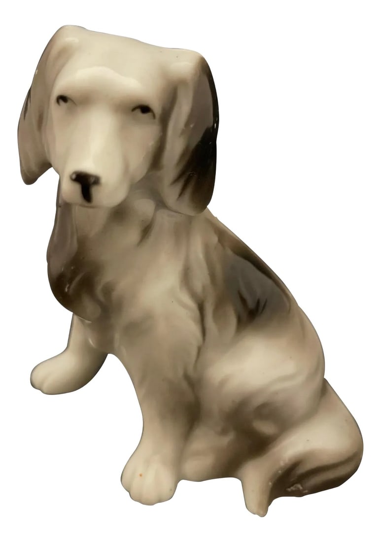 Porcelain Figure of a Dog, 20th Century: Porcelain Figure of a Dog, 20th Century. Made in Japan Condition: Alterations: Unknown Imperfections: Some Imperfections Condition Notes: Good Wear consistent with age and use. Dimensions: Height: 4