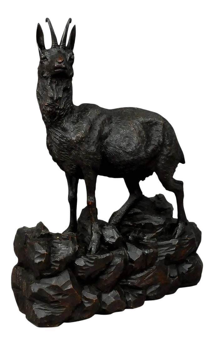 Black Forest Great Carved Wood Chamois Sculpture: Large Carved Wood Chamois Sculpture, Black Forest ca. 1900 An expressive naturalistic carved large chamois sculpture standing on a rocky base. It is handcarved and stainied lindenwood. Executed in