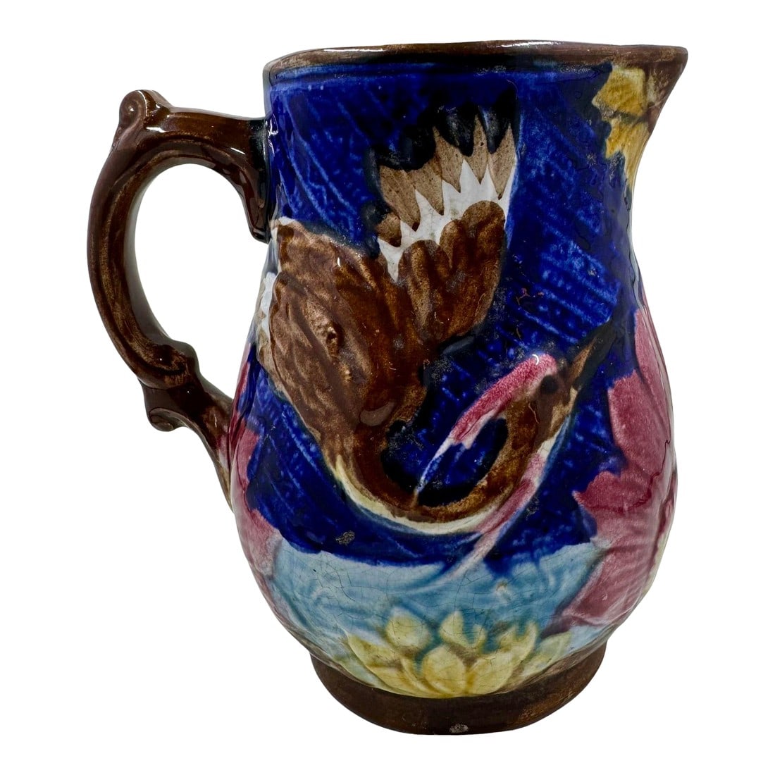 Antique 19th Century French Majolica Pitcher /Jug Decorated With Cranes: Stunning Antique French Majolica Pitcher /Jug Decorated With Brown & White Crane Birds and Bright Pink & Yellow Flowers Against A Rich Blue Background. The interior is coated in a cheerful turquoise
