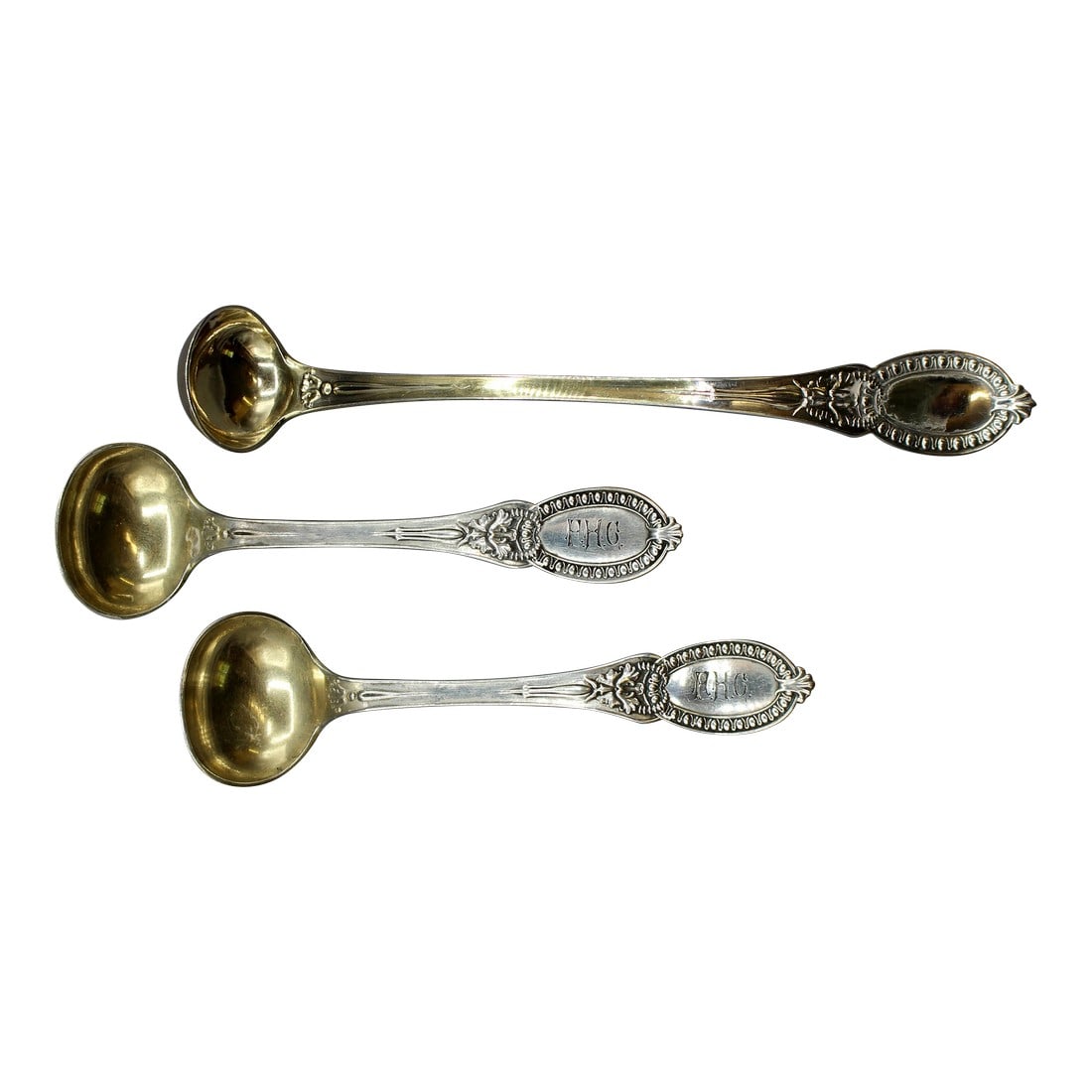 1859 Tiffany & Co Sterling Silver Condiment Ladle and Master Salt Spoons: 1859 Tiffany & Co sterling silver condiment ladle & pair of master salt spoons. Spoons monogrammed "RHC", gilt bowls. 1.30 troy oz. Ladle: 5 3/8" x 7/8" x 0.75". Spoons: 3 7/8" x 1.5" x 0.5".