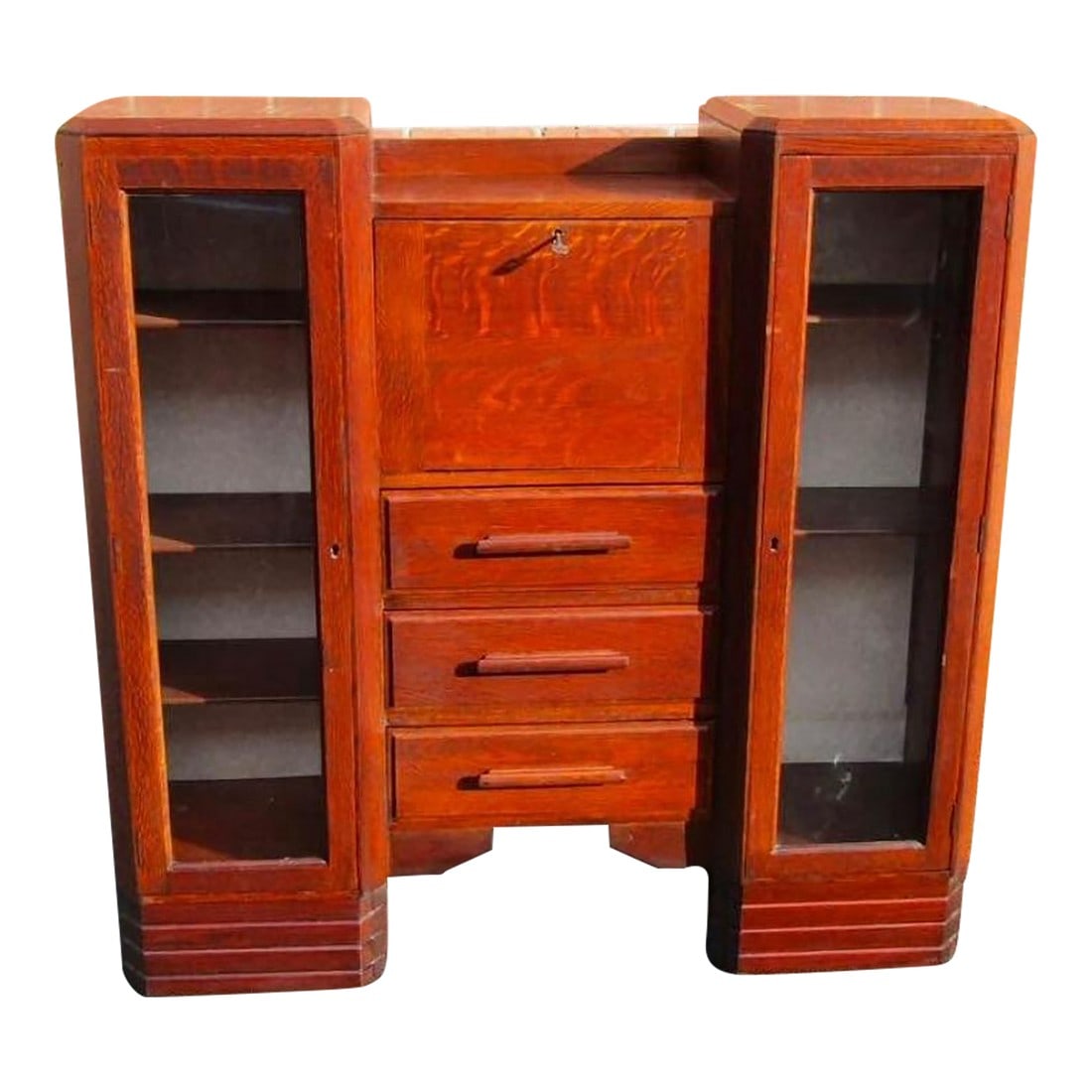 1920s Antique Art Deco Secretary Cabinet With Glass Doors: A stunning example of early 20th-century craftsmanship, this Art Deco secretary cabinet offers both style and utility. Made from rich, dark-stained wood, it features two glass-front display cabinets w