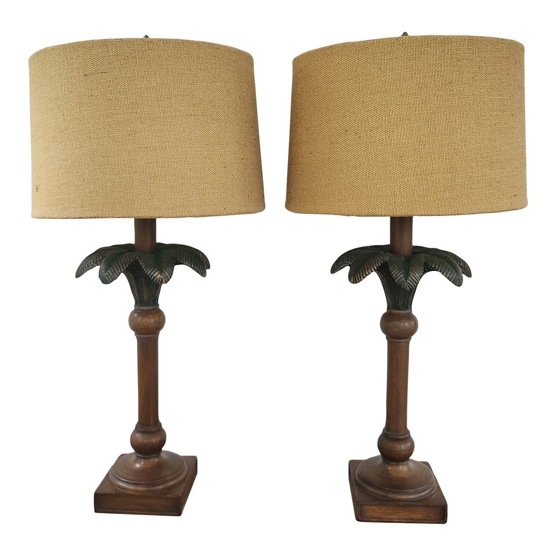 1980s Vintage Palm Leaf Table Lamps With Shades, a Pair: Trendsetting pair of Hollywood Regency style table lamps. They are made of metal with a palm tree motif. Each has arching leaves in a green paint finish with gold accents. The base is tall and sturdy.