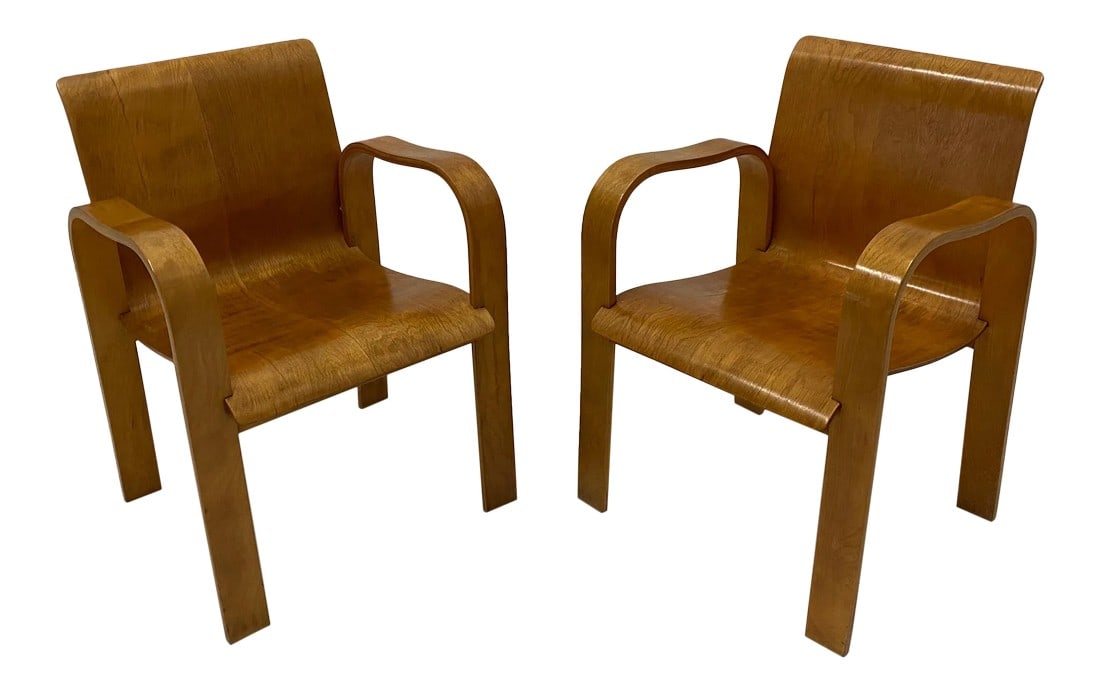 Molded Plywood Mid Century Modern Armchairs -Pair: A sleek pair of molded birch plywood armchairs in the manner of Alvar Aalto having sophisticated sculptural form and terrific comfort. arm height 25 Condition: Alterations: Original Condition