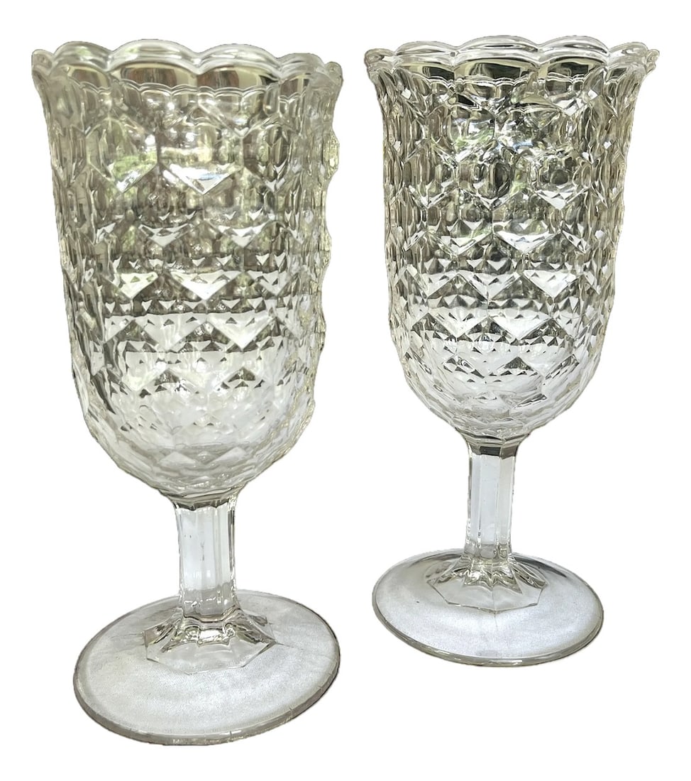 Antique Early American Pressed Glass Spooner or Celery Vases Honeycomb Pattern, Circa 1880s - A Pair: This exquisite pair of antique footed glass vessels features a radiant honeycomb or "thumbprint" pattern, richly textured and brilliantly refractive. Standing approximately 8.5 inches tall with a scal