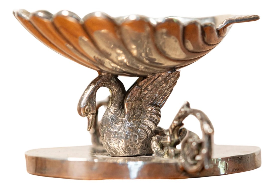 19th Century French Sculpture: This exquisite 19th-century French silver sculpture is a finely crafted decorative piece featuring an elegant swan motif. The design centers around a gracefully sculpted swan with intricately detailed