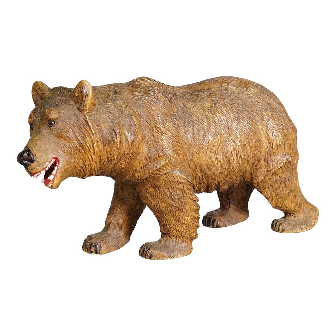 Large Vintage Wooden Strolling Bear Handcarved Ca. 1930s, Brienz: Large Vintage Wooden Strolling Bear Handcarved ca. 1930s, Brienz A large statue of a walking bear. Made of lindenwood, finely handcarved with naturalistic details in Brienz, Switzerland ca. 1930s. A n