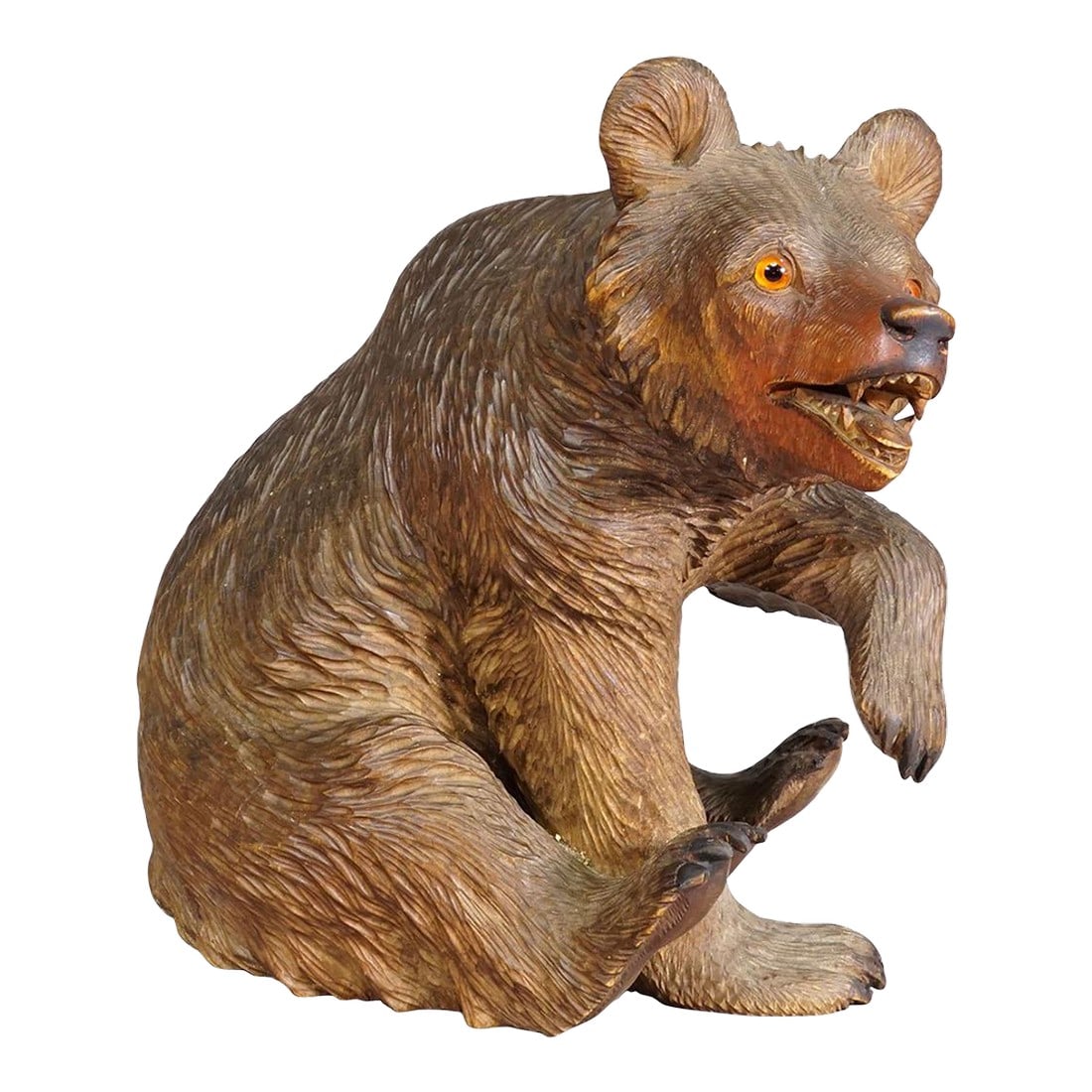 Antique Wooden Sitting Bear Handcarved Ca. 1920s, Brienz: Antique Wooden Sitting Bear Handcarved ca. 1920s, Brienz A large statue of a sitting bear. Made of lindenwood, finely handcarved with naturalistic details and glass eyes in Brienz, Switzerland ca.