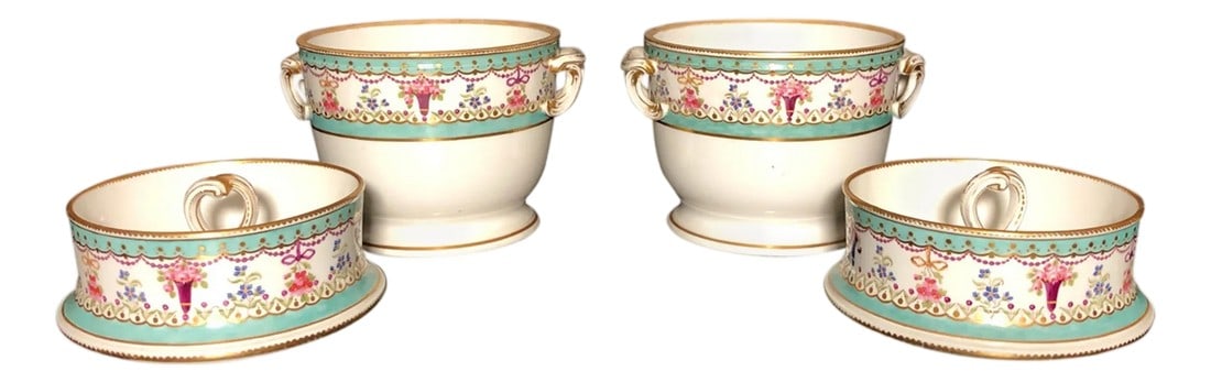 Early 19th Century Pair of Porcelain Continental Fruit Coolers: Pair of early 19th Century porcelain continental fruit coolers. Fine quality having a subtle turquoise banding, with gilding and colorful floral baskets, ribbons and garland. 18th/19th century.