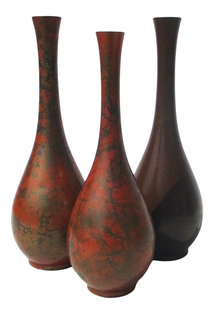Japanese Bronze Vases -A Group of 3: Japanese bronze tall necked vases. Formed alike, these vases are patinated in a dark bronze patina and two in the hand-made one-off manner of crackled iron oxide. and with a great deal of variety of