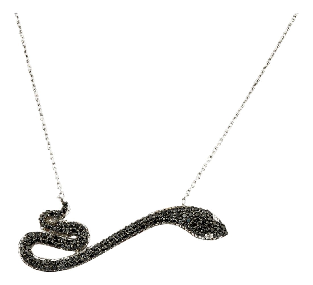 Natural diamond 0.56cts Snake pendant in 18k gold: GW=5.16gm NW=5.05gm diamond=0.56cts THIS IS A BRAND NEW PIECE Condition: Imperfections: No Imperfections Condition Notes: New Category: Pendants Origin: India Materials: 18K Gold, Diamond Shipping: