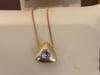 Three Piece Tanzanite Pendant & Earring Set In 14 Karat Yellow Gold with Chain - 16