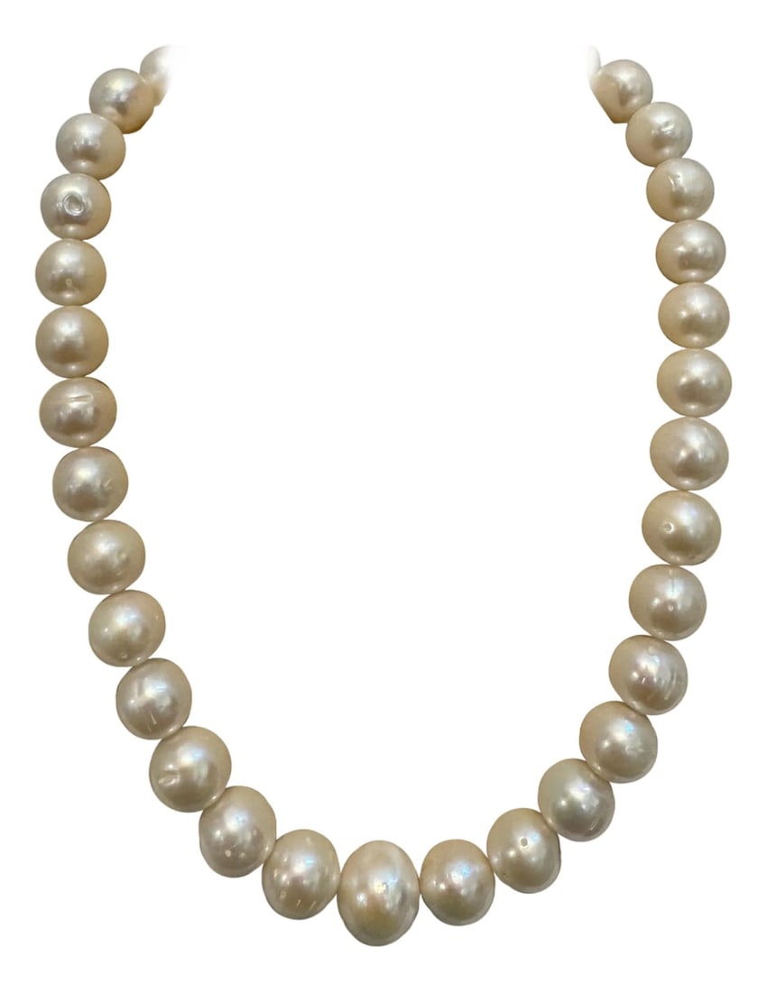 34 Round White Fresh Water Pearls Strand Necklace Set in Silver Clasp, 16 Inch: 34 Round White Fresh Water Pearls Strand Necklace Set in Silver Clasp, 16 Inch 12-15 mm Graduating Pearls Sterling silver clasp Estate piece Total weight of the necklace is 87 Grams length of the neck