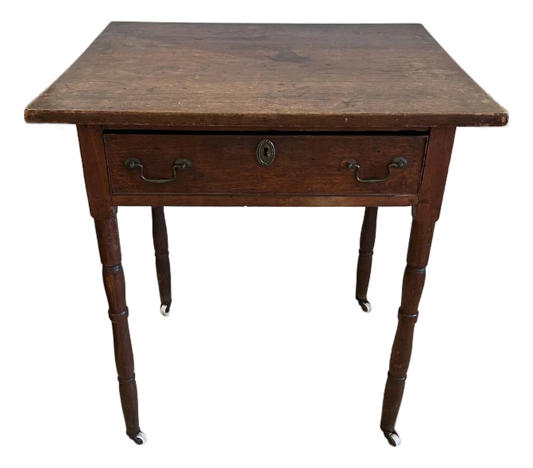 Antique Rustic Side Table With Single Drawer: Nice medium sized rustic antique wood side table having single drawer and handsome weathered patina. The small white pretty casters are a nice touch as well as the turned elegant legs. Condition: