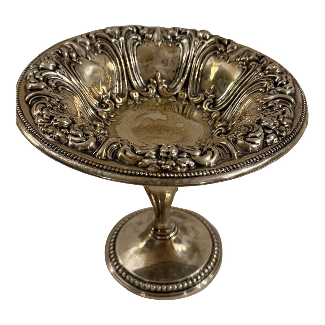 Antique Frank M. Whiting Footed Sterling Silver Dish With Floral Design: Antique Frank M. Whiting Company sterling silver footed dish featuring a long base and a delicately floral-decorated plate area. Elegant and versatile, suitable for display or serving small items.