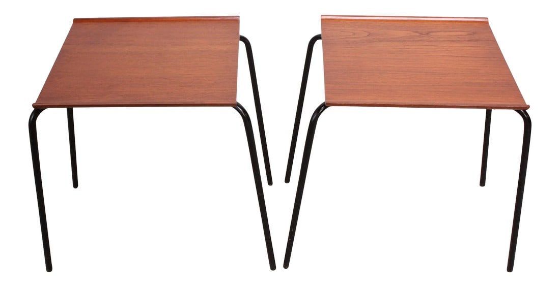 Danish Teak and Metal 'Stacking Tables' Attributed to Fritz Hansen - A Pair: These side or stacking tables are comprised of teak tops with a 'lip' on either side atop enameled metal bases. The construction of the bases is exact to those constructed by Arne Jacobsen for Fritz