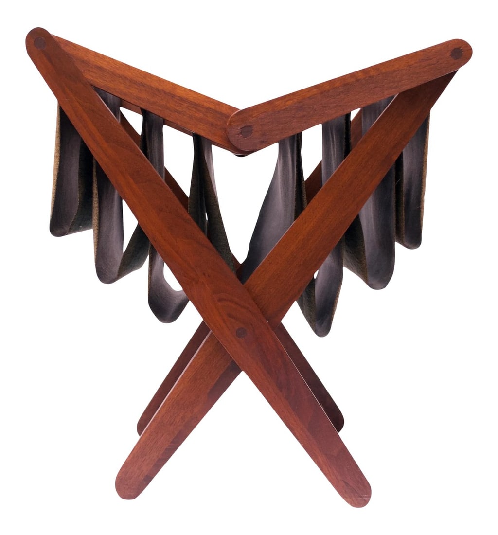 Henry P. Glass Walnut and Naugahyde Magazine Rack: Attractive Henry P. Glass magazine rack with sculpted walnut legs assembled using sophisticated wood joinery techniques (circular joints). Slots are made of Naugahyde (original to the design).