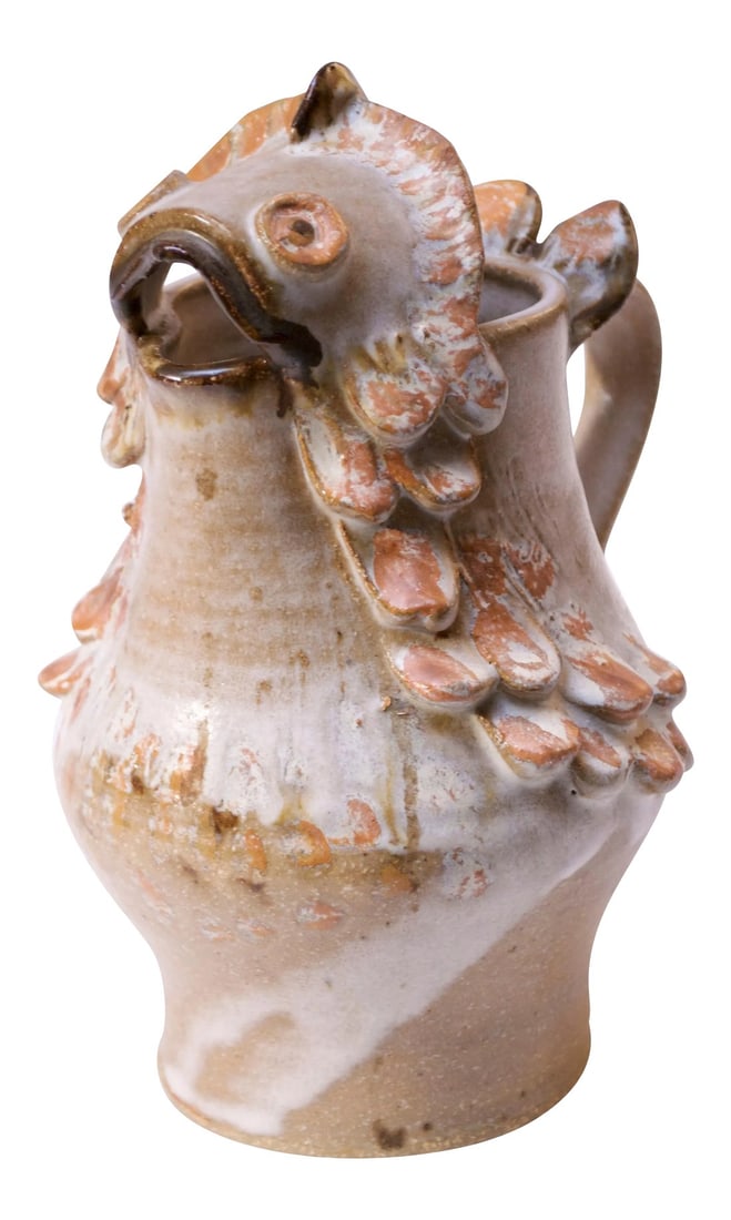 1976 American Studio Pottery 'Fish' Pitcher Signed Rush: Art pottery fish pitcher in attractive palette of beige, peach, brown, tan, and white. Heavily textured scale decoration throughout, 'frosted' with a dense white glaze. Signed 'Rush 76' tot the