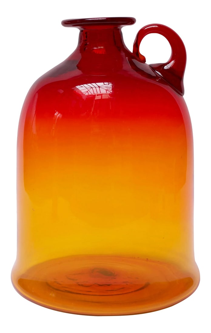 Blown Glass Amberina Tangerine Jug Designed by John Nickerson for Blenko: Blown glass jug designed by John Nickerson and manufactured by Blenko. This design first appeared in the 1972 Blenko catalog as model number 7226S. Large size and attractive amberina / tangerine