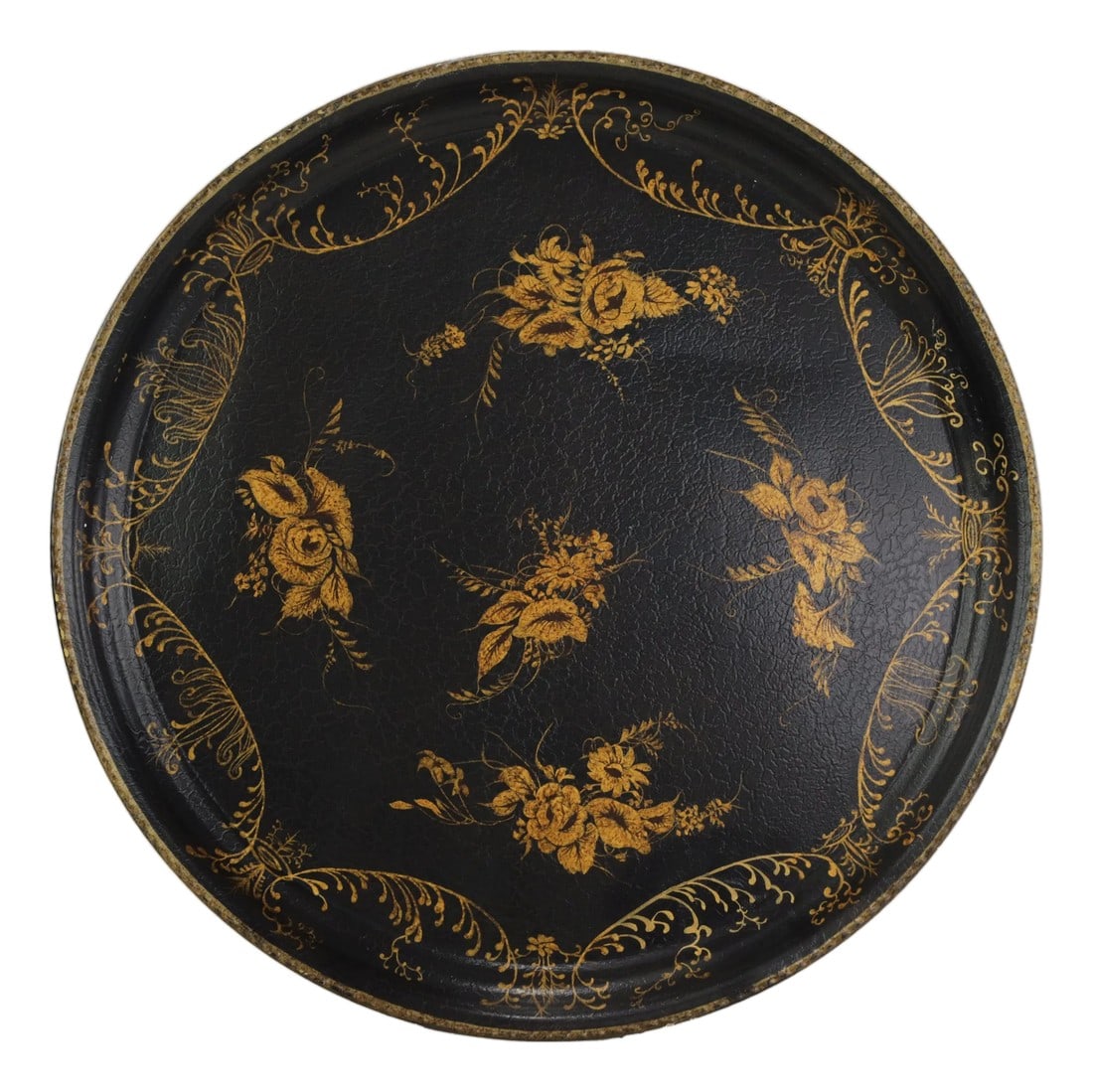 Vintage Hand Painted Tole Tray Black Lacquer With Gold Gilt Floral Bouquets and Ornate Scrollwork: This elegant vintage round tole tray features a deep black lacquer finish serving as a dramatic backdrop for its sophisticated hand-painted golden ornamentation. The central composition consists of