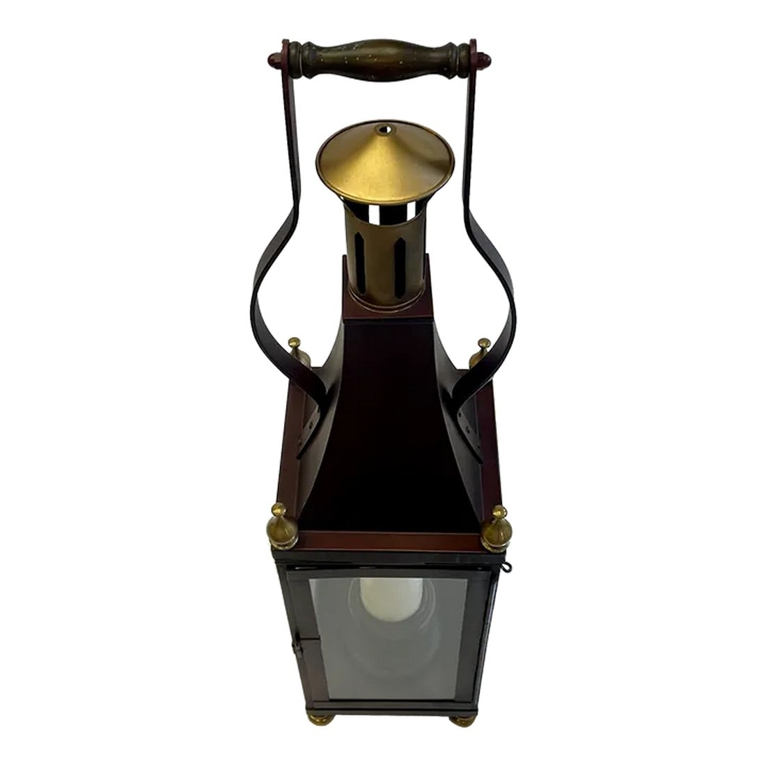 Iron Brass & Glass Table Lantern by Chapman: Striking large table top lantern by Chapman having black metal with gold embellishments, glass doors and single candle holder. Handsome wooden handle on top. Condition: Alterations: Original