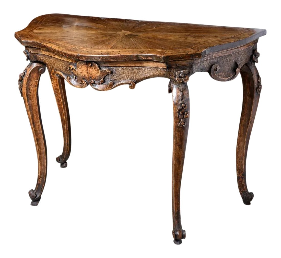 Antique Italian Walnut Console Table: Antique Italian walnut console table with inlaid fan motif and inlaid line decoration. Has shaped apron with scroll and flower wood carved decoration on cabriole legs and scroll feet. Condition: Alter