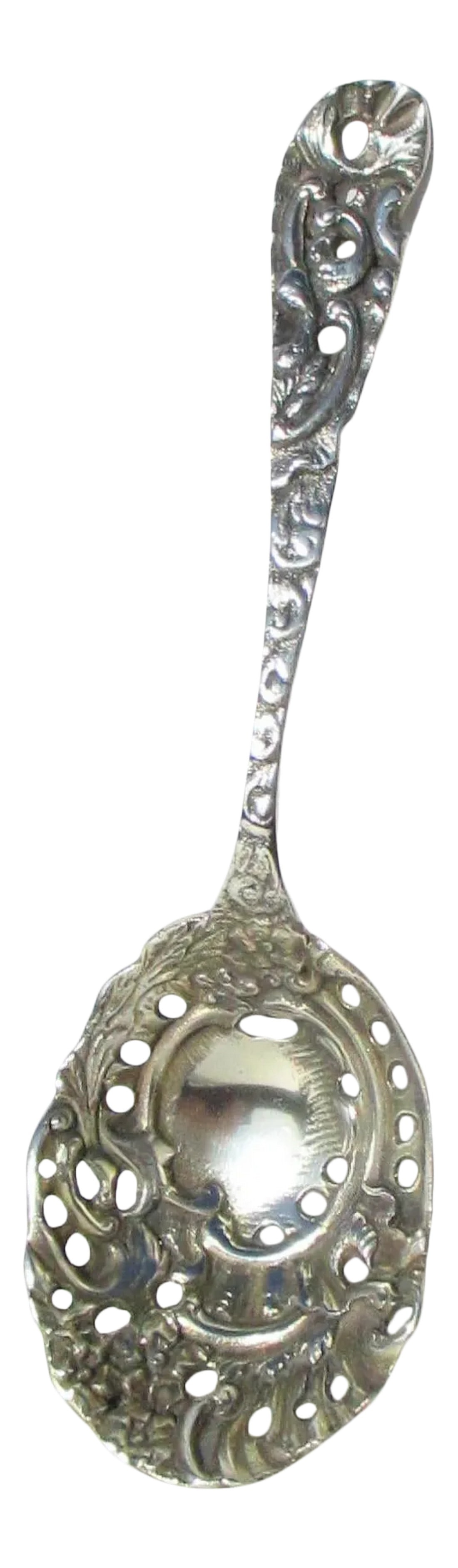 Vintage Sterling Silver Beaux Art Slotted Berry Spoon: Sterling silver slotted berry spoon in high Beaux-Arts style. Very fine model cast from original in thick silver. Marked Sterling to the reverse of the handle. The size is 8.75" long and 2.6" wide at 