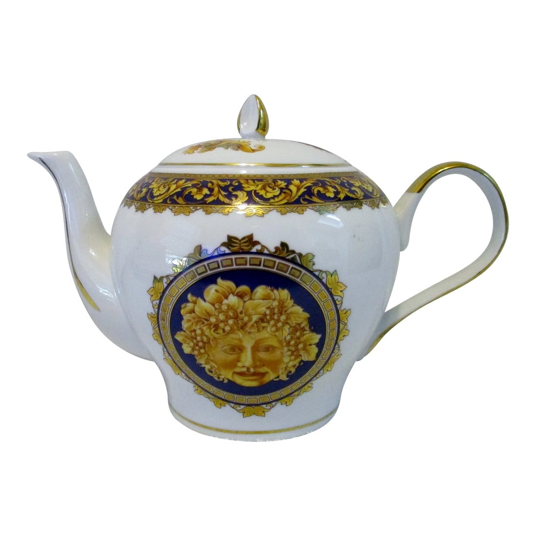 1980s T. Limoges France Depos Porcelain Bacchus Tea Pot: T. Limoges France Depose Porcelain Bacchus Teapot 7.00" H x 10.00" W handle to spout x 6.00" W Designed in France, this Bacchus portrait decoration in the style of Versace's Medusa, with gilt foliate