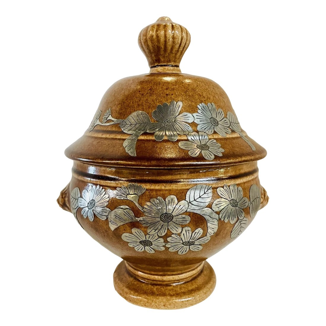 Mid Century Pottery Urn With Metal Accents: Beautiful brown Mid-Century pottery urn with artisan hand crafted florals in pewter. Intricate details. Dimensions: 11 inches height, 9 inches diameter including handles, 7 inches depth. Condition: