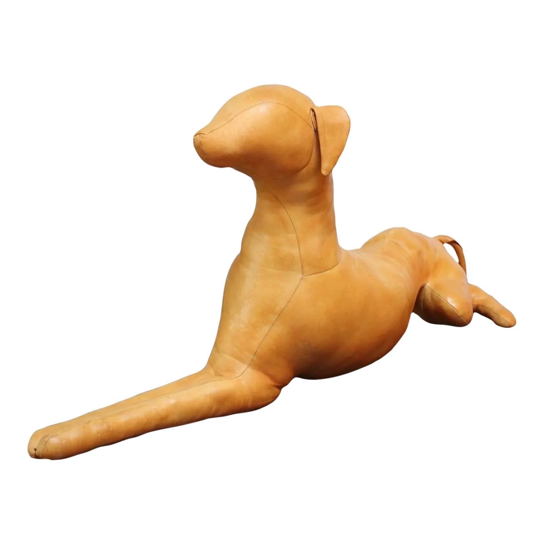 Vintage Hand-Stitched Leather Dog Sculpture: Buttery leather puppy dog sculpture in the Style of Dmitri Omersa (ca. 1980s, USA). Very good, vintage condition with light patina/normal age consistent with age/use (due to the handmade construction 