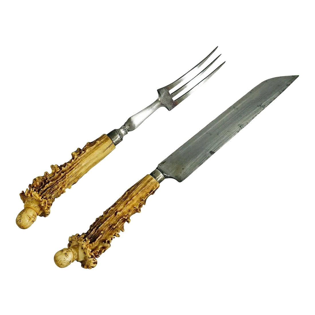 Antique Set of Rustic Serving Cutlery With Carved Horn Handles 19th: Antique Set of Rustic Serving Cutlery with Carved Horn Handles 19th A rare antique set of knive and fork as serving cutlery. The handles are made of deer horn with handcarved heads of Victorian childr