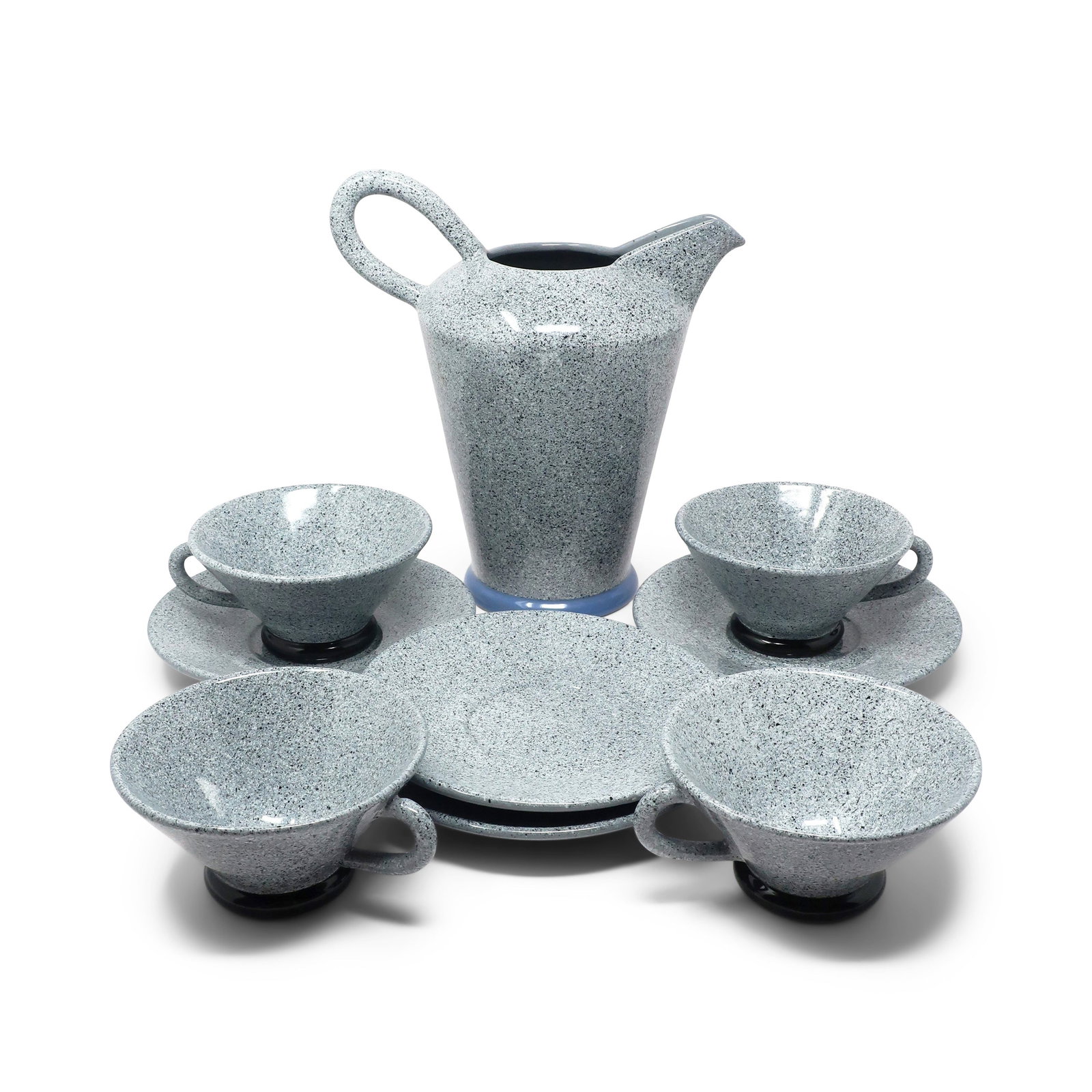 1980s Postmodern Cups, Saucers and Pitcher Set by Baldelli: A 1980s set of four cups, four saucers, and a pitcher by Italian ceramics manufacturer Baldelli. Gray, black and white speckled exterior, solid gray interior, and solid colored base (cups base are
