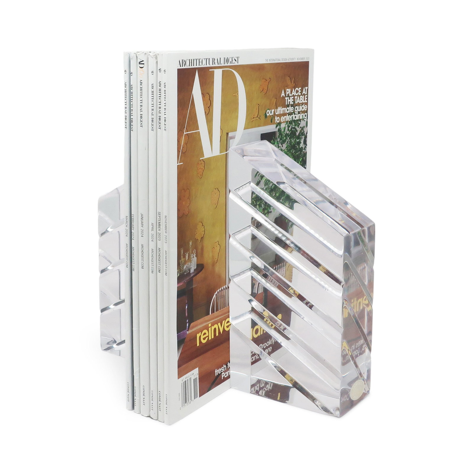 1980s Faceted Lucite Bookends by Ritts Co. of Los Angeles: A pair of mid-century modern "Astrolite" lucite bookends by the Ritts Company of Los Angeles that are strikingly etched and polished, which catches and refract lights beautifully. The Ritts Company wa