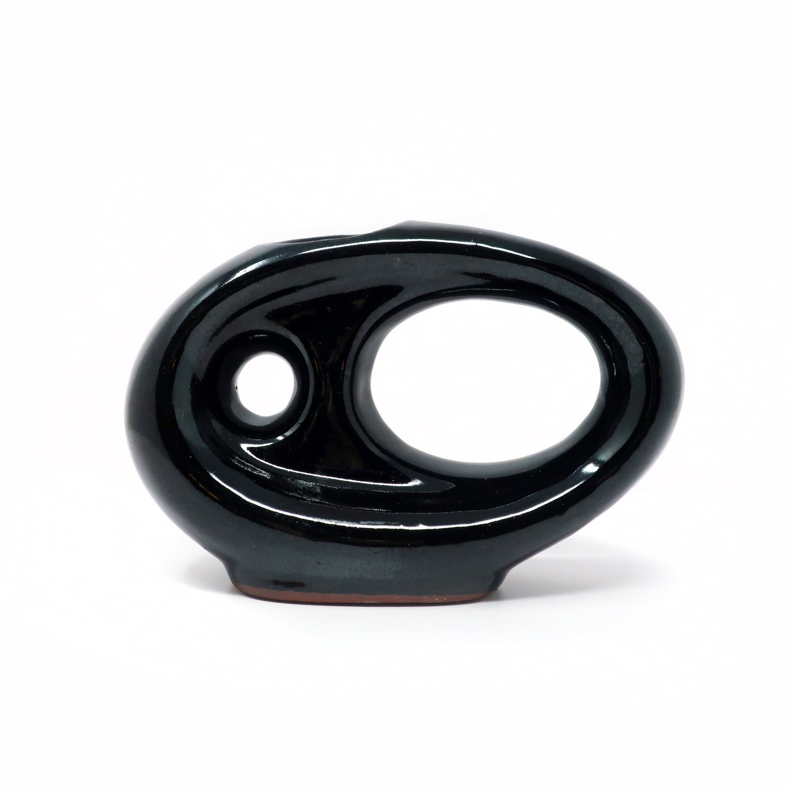 Vintage Asymmetrical Black Pottery Vase: A charmingly mid-century or post modern asymmetrical pottery vase with shades of a flying V guitar. Glossy black glaze with no maker's mark. In very good vintage condition. 7.5" x 3" x 5.5" Reserve: $
