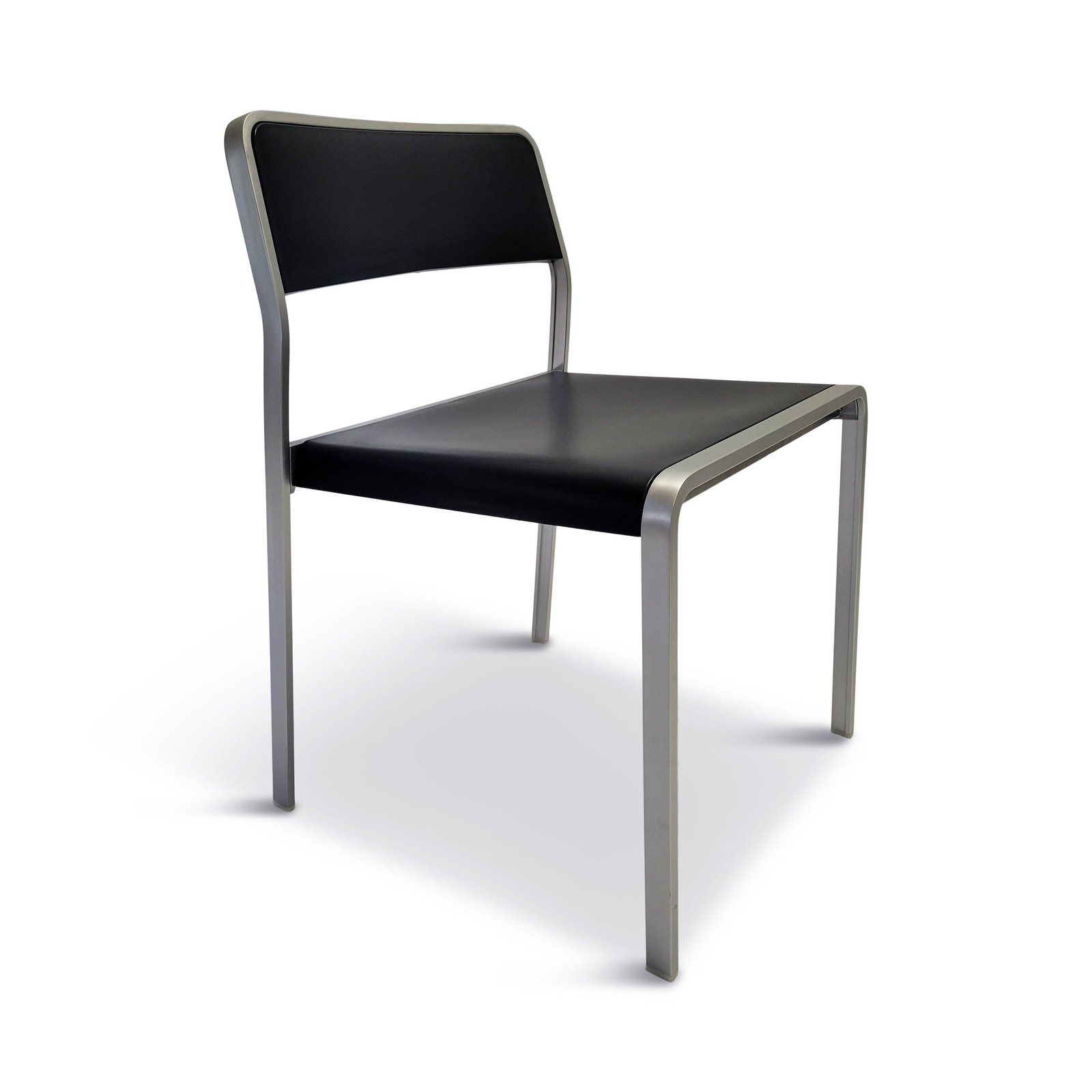 Set of 4 Bridge Chairs by Carlo Tamborini for Pallucco: Designed in 2001 and produced by Pallucco in 2002, the Bridge is a Carlo Tamborini-designed stackable chair with a metal frame and plastic seat and back. The Bridge chair is very similar to