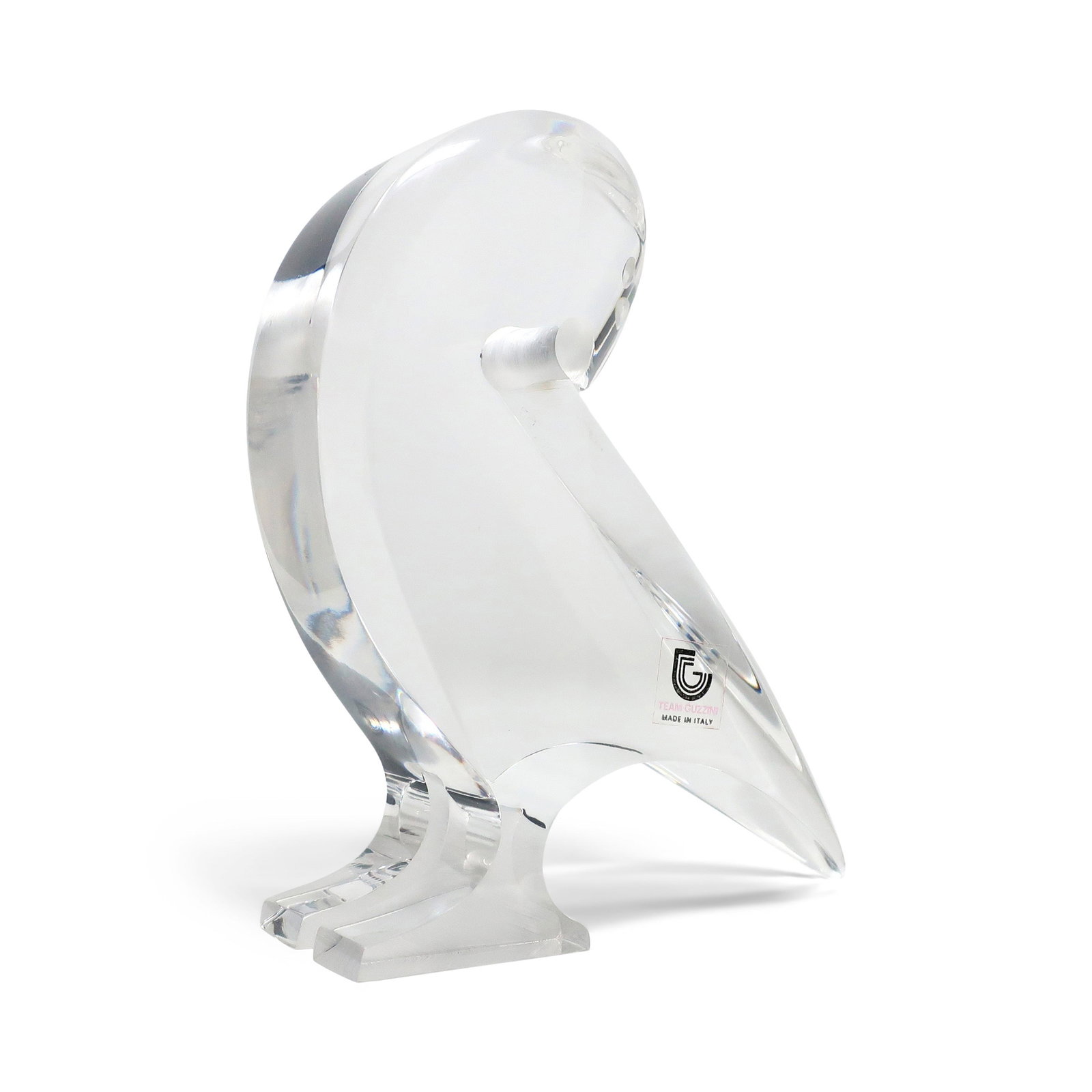 Vintage Lucite Bird Sculpture by Team Guzzini: A vintage stylized bird sculpture in lucite by Tim Crea for Guzzini. In very good vintage condition with "Team Guzzini Made in Italy" sticker. 5" x 1.5" x 5" Reserve: $25.00 Shipping: Domestic: