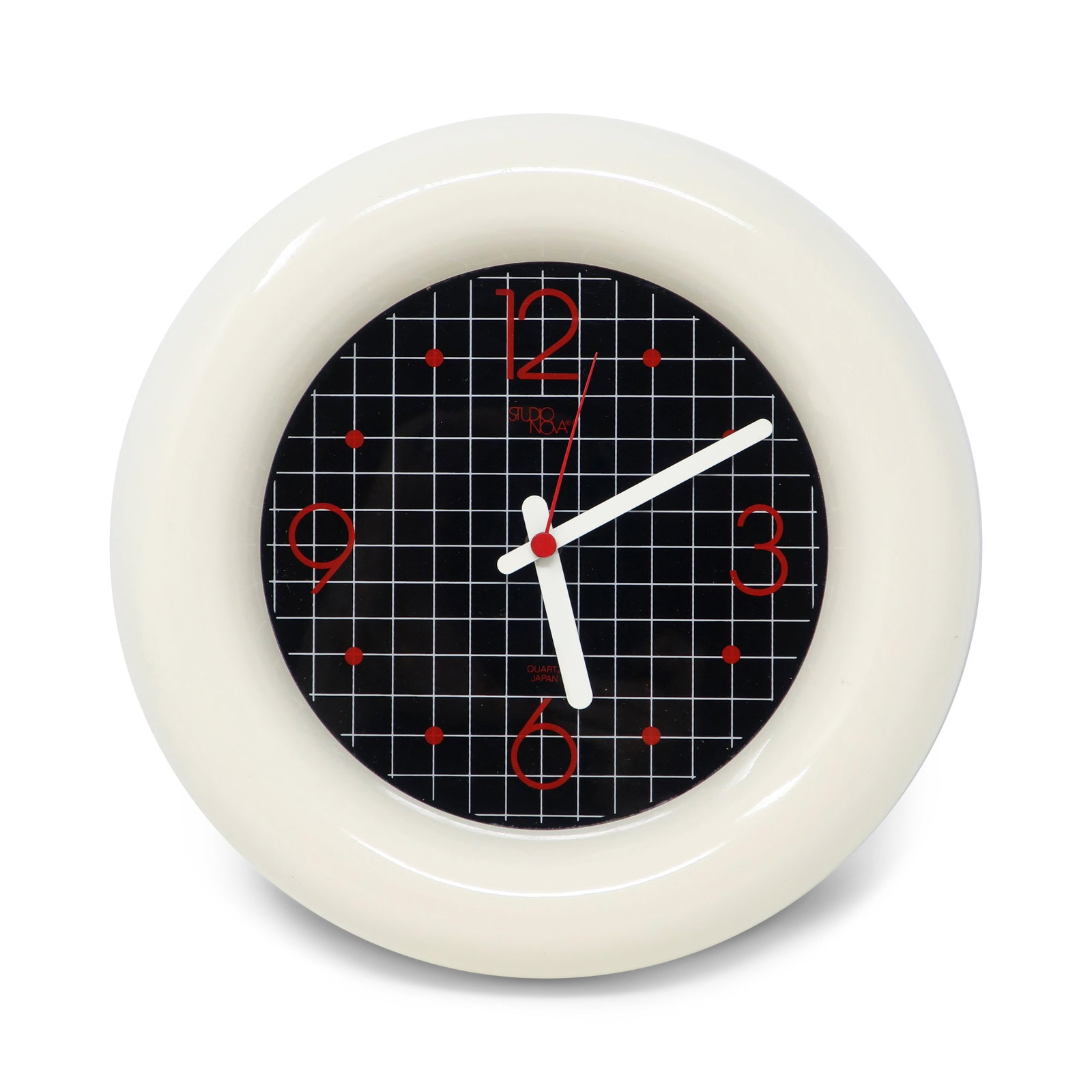1980s Graphic Wall Clock by Studio Nova Japan: A very cool and unique 1980s wall clock by Studio Nova Japan with a cartoonish white border, black face with white grid lines, red numbers and white hands. Will look great in your office, living room 