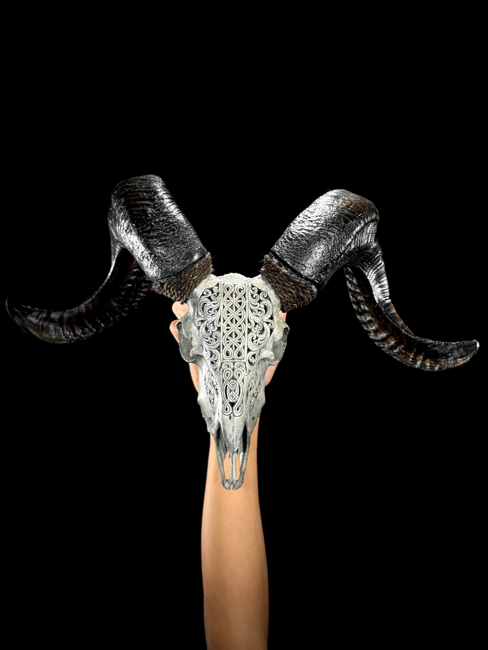 Carved grey ram skull - Infinity motif: Title: Carved grey ram skull - Infinity motif Maker:Unknown Origin: Indonesia Date/Period:2026 Materials:Ovis Aries, Bone, Horn Dimensions:Height: 47 cm / 18.5 inches Width: 55 cm / 21.6 inches