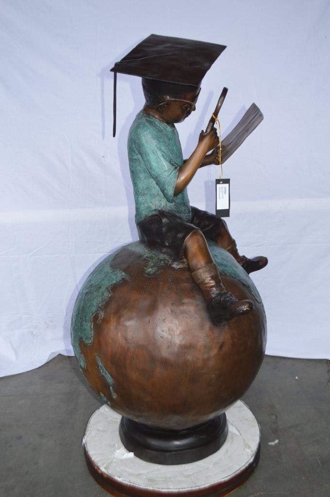 Student learning on top of world bronze statue - Size: 28"L x 24"W x 52"H. - 6