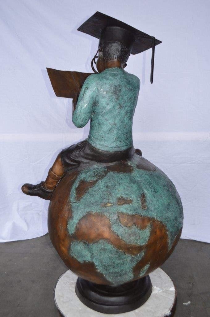 Student learning on top of world bronze statue - Size: 28"L x 24"W x 52"H. - 9