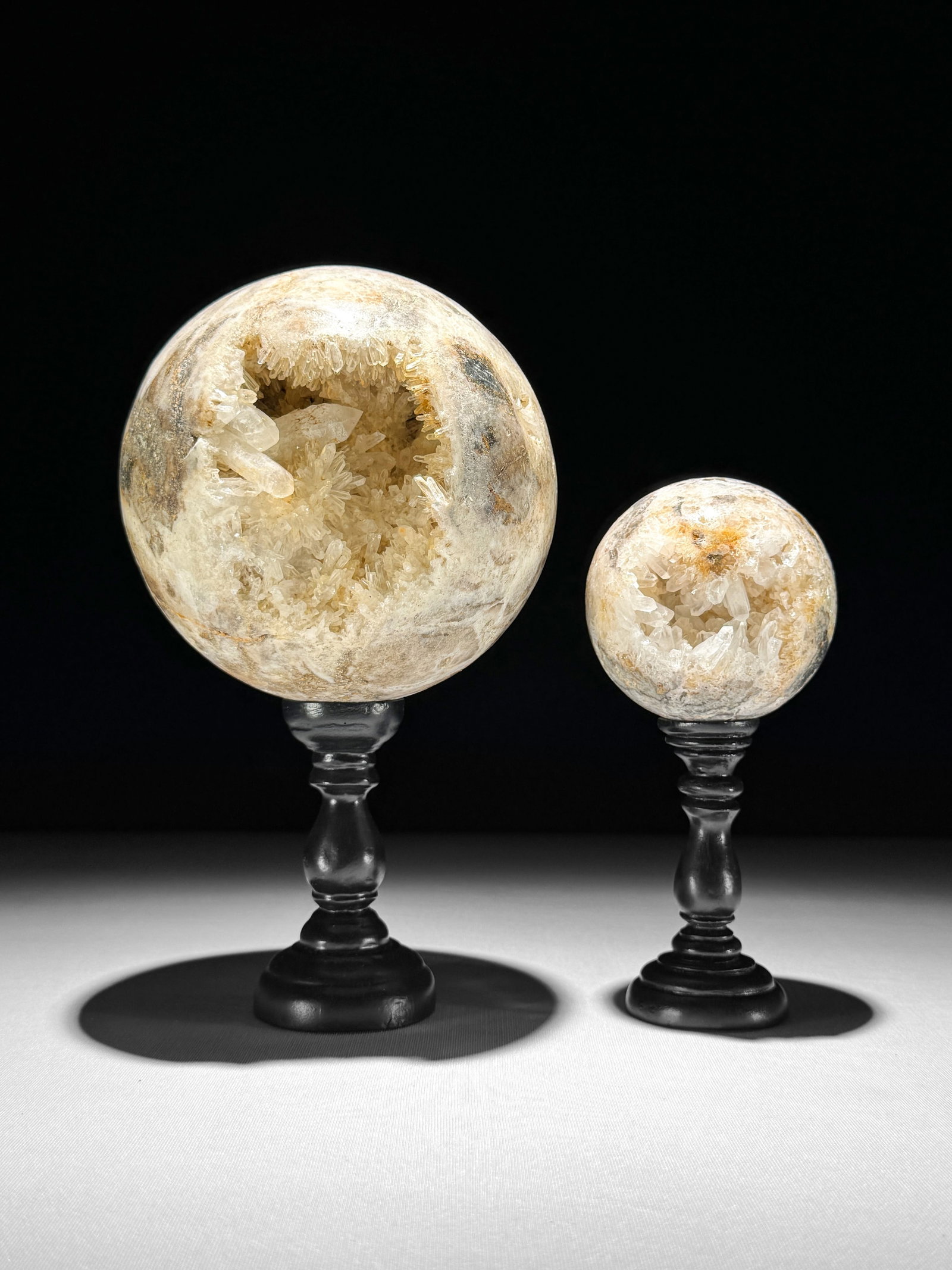 Wonderful set of 2 crystal spheres with stands: Title: Wonderful set of 2 crystal spheres with stands Maker:Unknown Origin: Indonesia Date/Period:2026 Materials:Crystal quartz, resin Dimensions:Diameter sphere 1: 10.7 cm / 4.2 inches Height: 19.2
